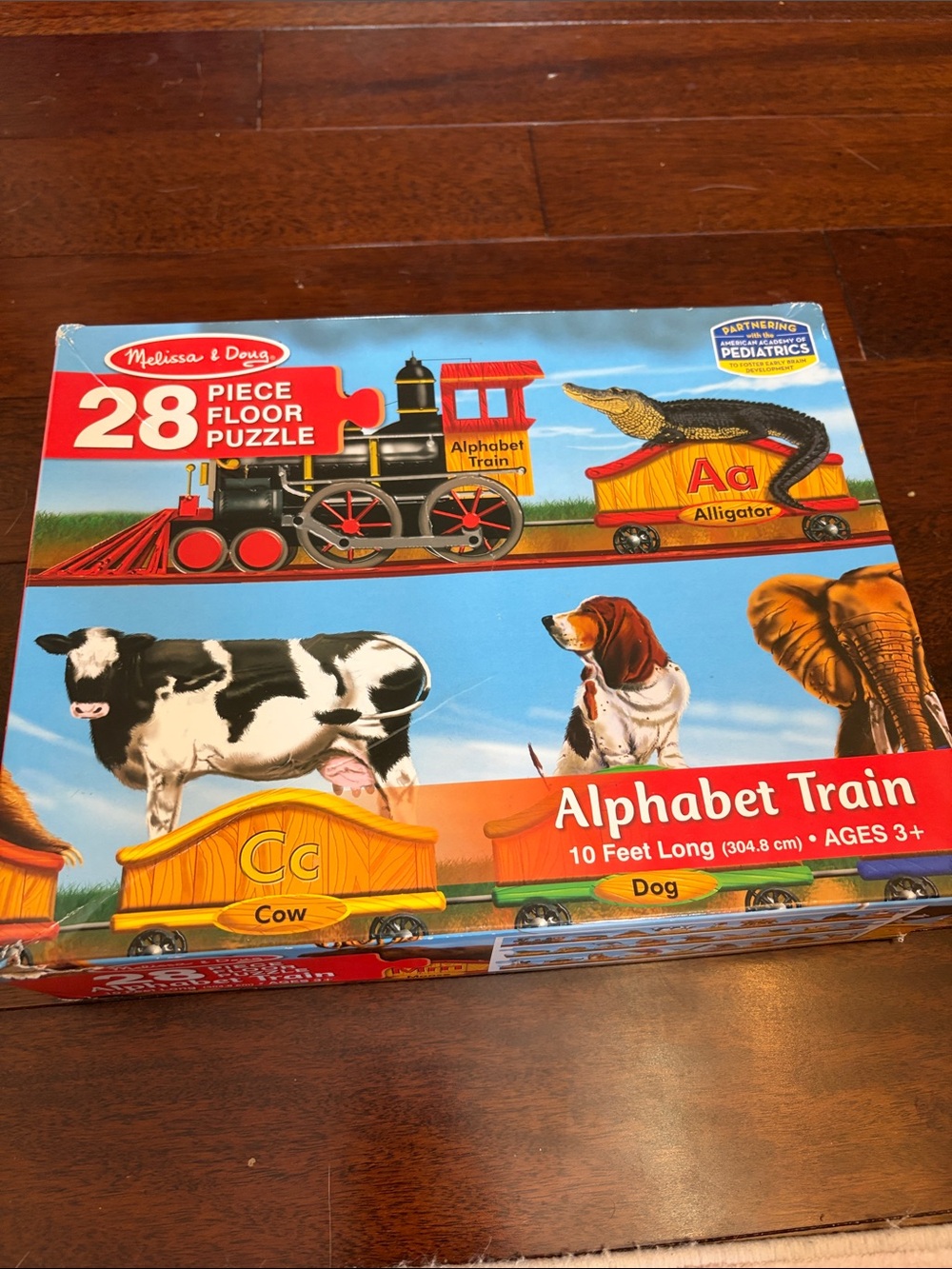 Melissa & Doug Alphabet Train Puzzle - Blue Background with Red Accents
